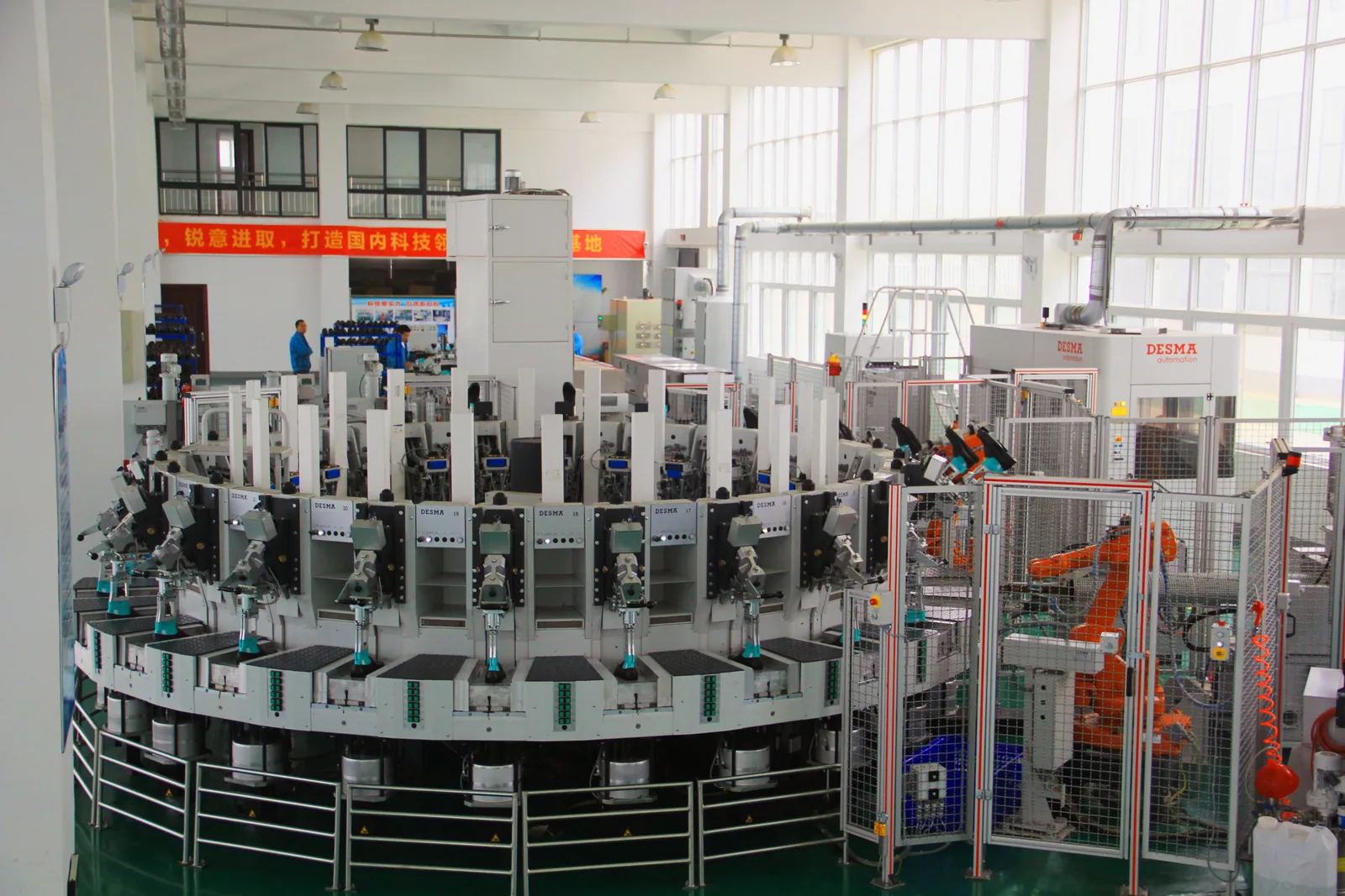 Automated footwear production equipment in a safety shoe factory